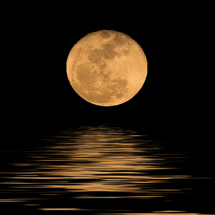 full moon reflection over water at night