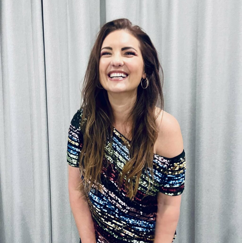 Woman in sequin top laughing